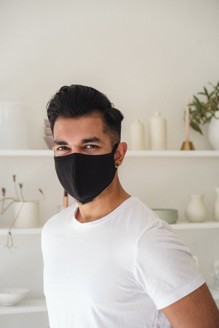 man-smiling-man-in-black-cloth-face-mask